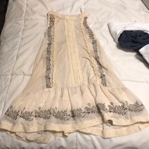 High neck tan shirt with lace and floral detail